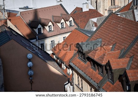 High angle perspective of historic red-tiled roofs and attic windows in the Old Town, Bratislava, Slovakia, Central Europe.