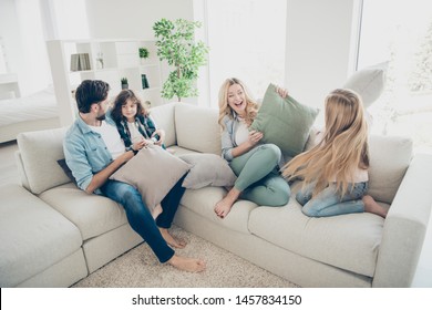 High Angle Photo Of Big Family Four Members Spend Free Time Bonding Playing Pillows Sit Cozy Couch