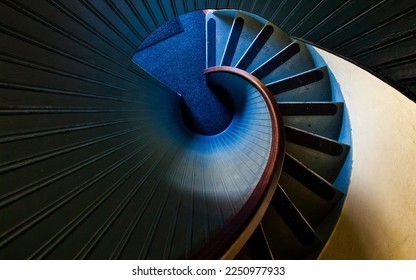 high angle photography of blue spiral staircase blue and black spiral staircase - Powered by Shutterstock