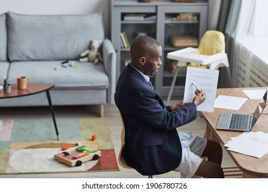 High Angle Portrait Of African-American Man Wearing Formal Jacket And Shorts During Online Meeting While Working From Home, Copy Space