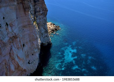 A high angle shot coastal cliff   erosion boulder in Maltese Islands