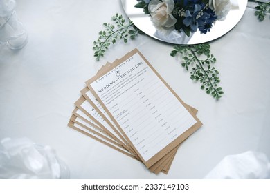 A high angle shot of funny wedding guest mad libs as decorations