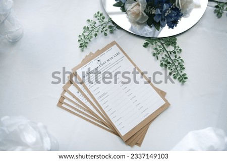 A high angle shot of funny wedding guest mad libs as decorations