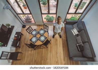 A High Angle Shot Of A Living Room With A Male Model