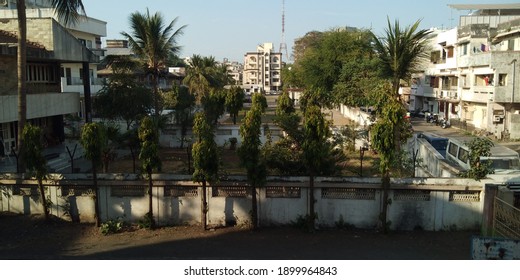 A High Angle Shot Of The Park And Buildings Of A Neighborhood During The Daytime