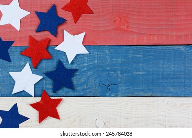 High Angle Shot Of Red White And Blue Stars On A Patriotic Picnic Table. The Wood Table Is Painted Red, White And Blue. Perfect For Memorial Day Or 4th Of July Themes, With Copyspace.