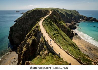 A High Angle Shot Of A Road On The Cliffs Over The Ocean Captured In Herm Island, Channel Islands