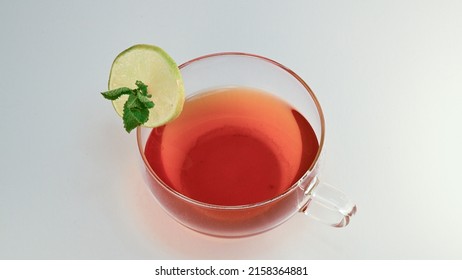 A High Angle Shot Of A Tea Cocktail Isolated On A White Background