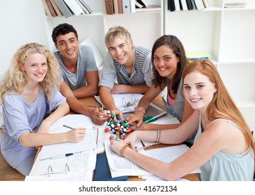 High angle of teenagers studying Science in a library together