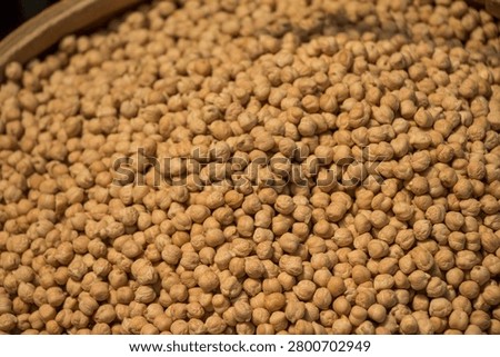 High angle texture background of organic dry garbanzo beans in a grocery store