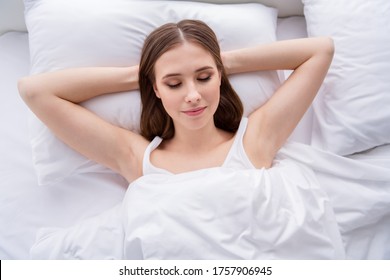 High Angle Top Above View Photo Of Charming House Wife Young Lady Lying Sheets Bed Covered Blanket Pillow Hands Behind Head Eyes Closed Weekend Saturday Morning Quarantine Room Indoors