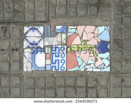 High angle view abstract artistic colored mosaic at cobblestone street, ciudad vieja, montevideo city, uruguay
