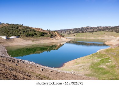 High Angle View Of Anderson Reservoir, A Man Made Lake In Morgan Hill, Managed By The Santa Clara Valley Water District, Maintained At Low Level Due To Failure Risk In Case Of Earthquake; California