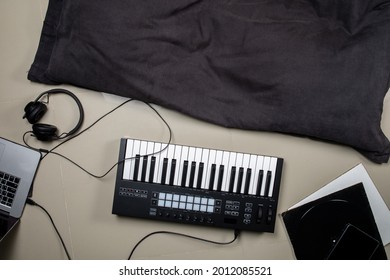 High Angle View Of Asian Girl Sit And Play Music In The Living Room At Home.