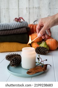 High Angle View Autumn Composition With Sweaters And Candles, White Candle Mockup Design