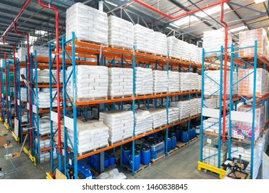 High angle view of barrel and goods arranged on a rack in warehous. This is a freight transportation and distribution warehouse. Industrial and industrial workers concept