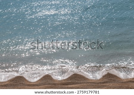 A high angle view of beach cusps in Dorset, viewed from the coastal path near Osmington