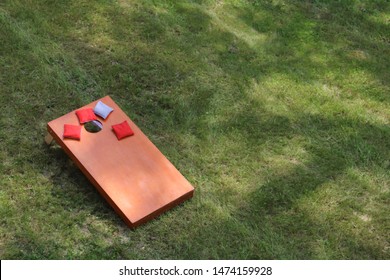 high angle view of Bean Bag Toss Corn Hole Game red bags and wood platform