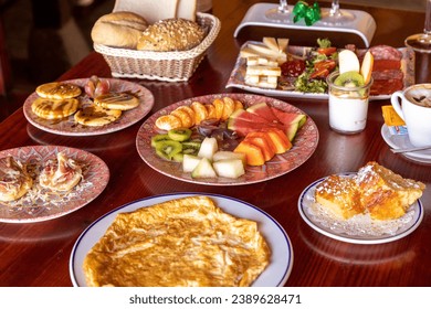 a high angle view of a breakfast table full of food