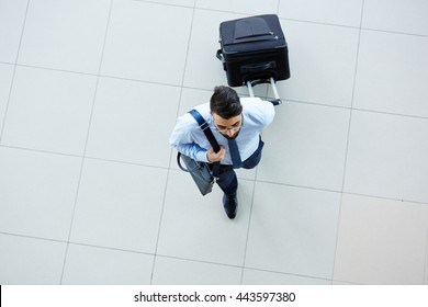 High Angle View Of Businessman Leaving For Business