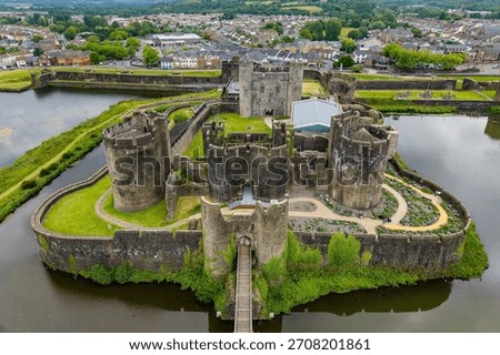 High angle view of Caerphilly Castle ruins, showing its concentric design and moat