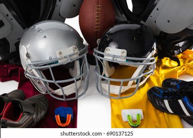 High angle view of chest protector with American ball and sports gears on white background - Powered by Shutterstock