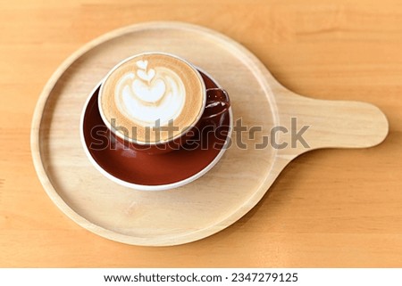 high angle view of coffee cup on wood grain table Drinking Concept: Hot Coffee, Latte, Espresso, Cappuccino