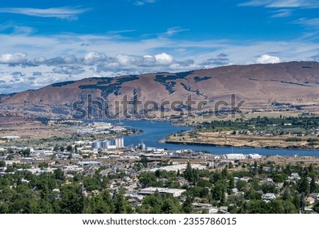 A high angle view of the columbia river and city of the dalles industrial area