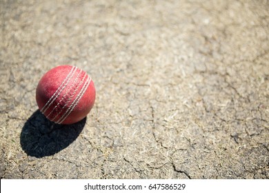 High angle view of cricket ball on pitch during sunny day - Powered by Shutterstock