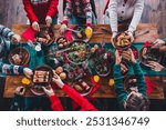 High angle view cropped photo of group family members eat food table gather celebrate christmas apartment indoors