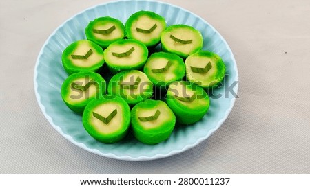 High angle view of delicious green pandan nona manis cakes on a plate