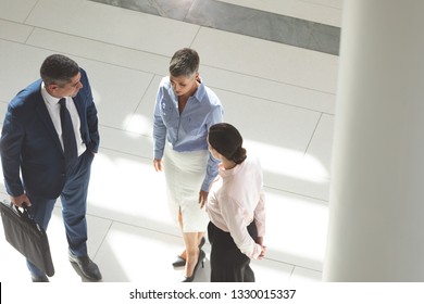 High Angle View Of Diverse Business People Interacting With Each Other In Lobby Office