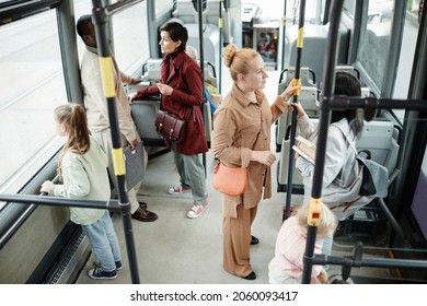 High angle view at diverse group of people in public bus, copy space