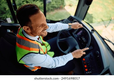 High angle view of driver driving a bus. 