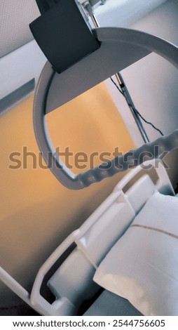 High angle view of an empty hospital bed in a cold, disquieting atmosphere. Dutch angle.