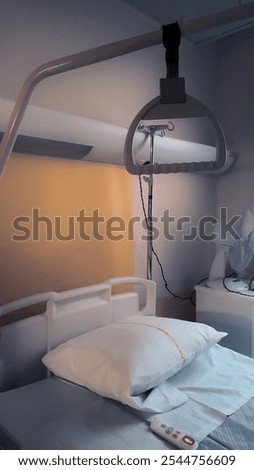 High angle view of an empty hospital bed in a cold, disquieting atmosphere.