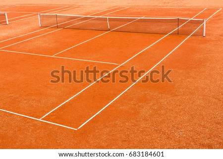 High angle view of empty, red clay, tennis court