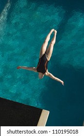 High Angle View Of A Female Diver In Midair Diving