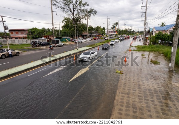 High angle view, flooding the road until the\
car can\'t go., Meng District, Ubon Ratchathani Province, Thailand,\
on October 3, 2022, is a photograph from real flooding. With a\
slight color adjustment