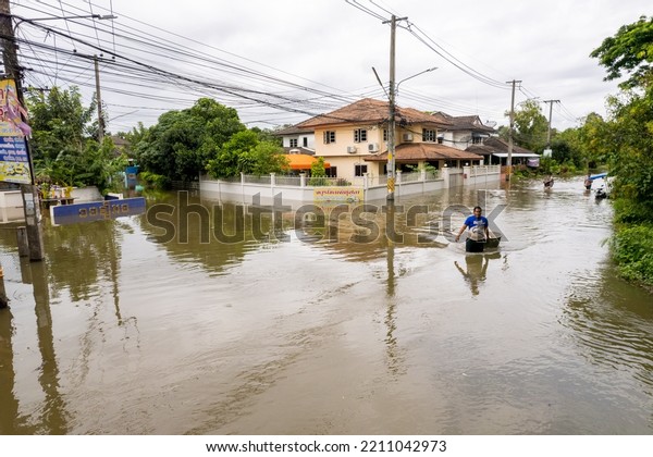 High angle view, flooding the road until the\
car can\'t go., Meng District, Ubon Ratchathani Province, Thailand,\
on October 3, 2022, is a photograph from real flooding. With a\
slight color adjustment