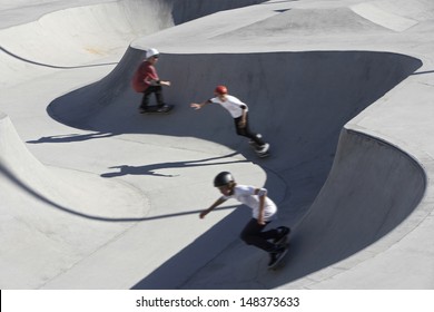 High angle view of friends skateboarding in park - Powered by Shutterstock