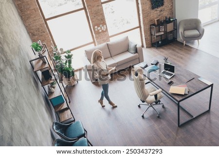 High angle view full size photo of business lady hold read book walk loft office room building