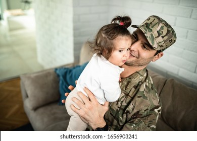 High Angle View Of Happy Military Man Spending Time With Is Daughter At Home. 