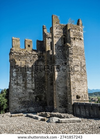 High Angle View Of The Imposing Ruins Of A Scaliger Castle Tower Under A Deep Blue Summer Sky, Valeggio Sul Mincio, Italy.