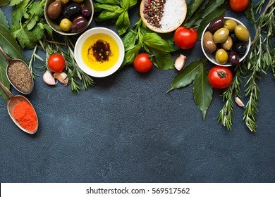 High Angle View of Italian Food IngredientsBbackground with Herbs, Olives, Oil and Tomatoes. Empty space for your text
