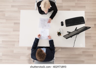 High Angle View Job Interview At Desk