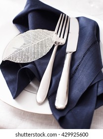 High angle view of knife fork and napkin on place setting