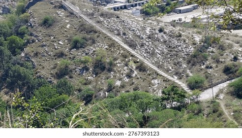 High Angle View Of Long Stone Stairway Crossing Rocky Hillside