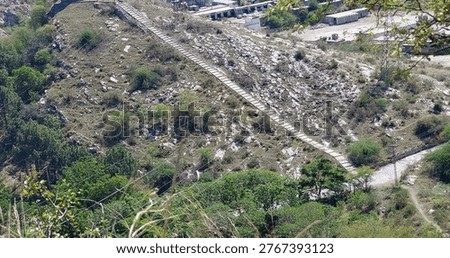High Angle View Of Long Stone Stairway Crossing Rocky Hillside