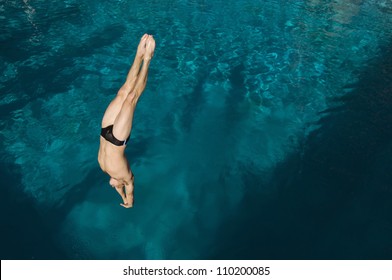 High Angle View Of A Man Diving Into The Pool